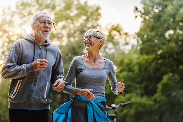 A senior couple goes for a morning jog. Dr. Vic Goradia of G2 Orthopedics serves many active senior adults with joint issues such as arthritis.